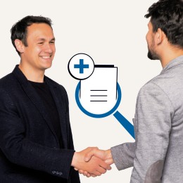 Two men shake hands. A graphic showing a document with a plus sign inside a magnifier glass is also seen.